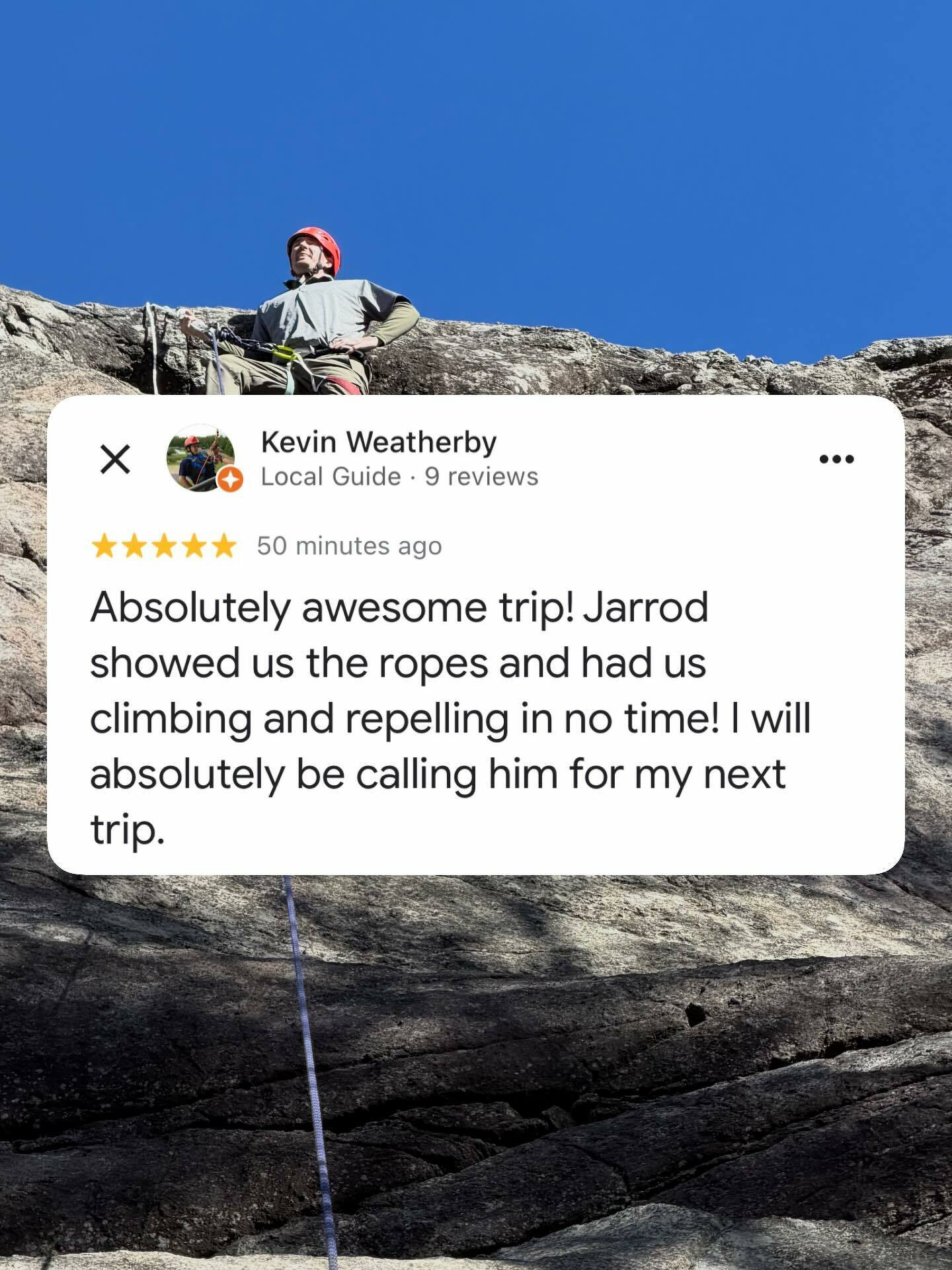 A person wearing a helmet stands on a rocky cliff holding climbing equipment against a clear blue sky. Text reads Kevin Weatherby Local Guide 9 reviews 50 minutes ago Absolutely awesome trip Jarrod showed us the ropes and had us climbing and repelling in no time I will absolutely be calling him for my next trip