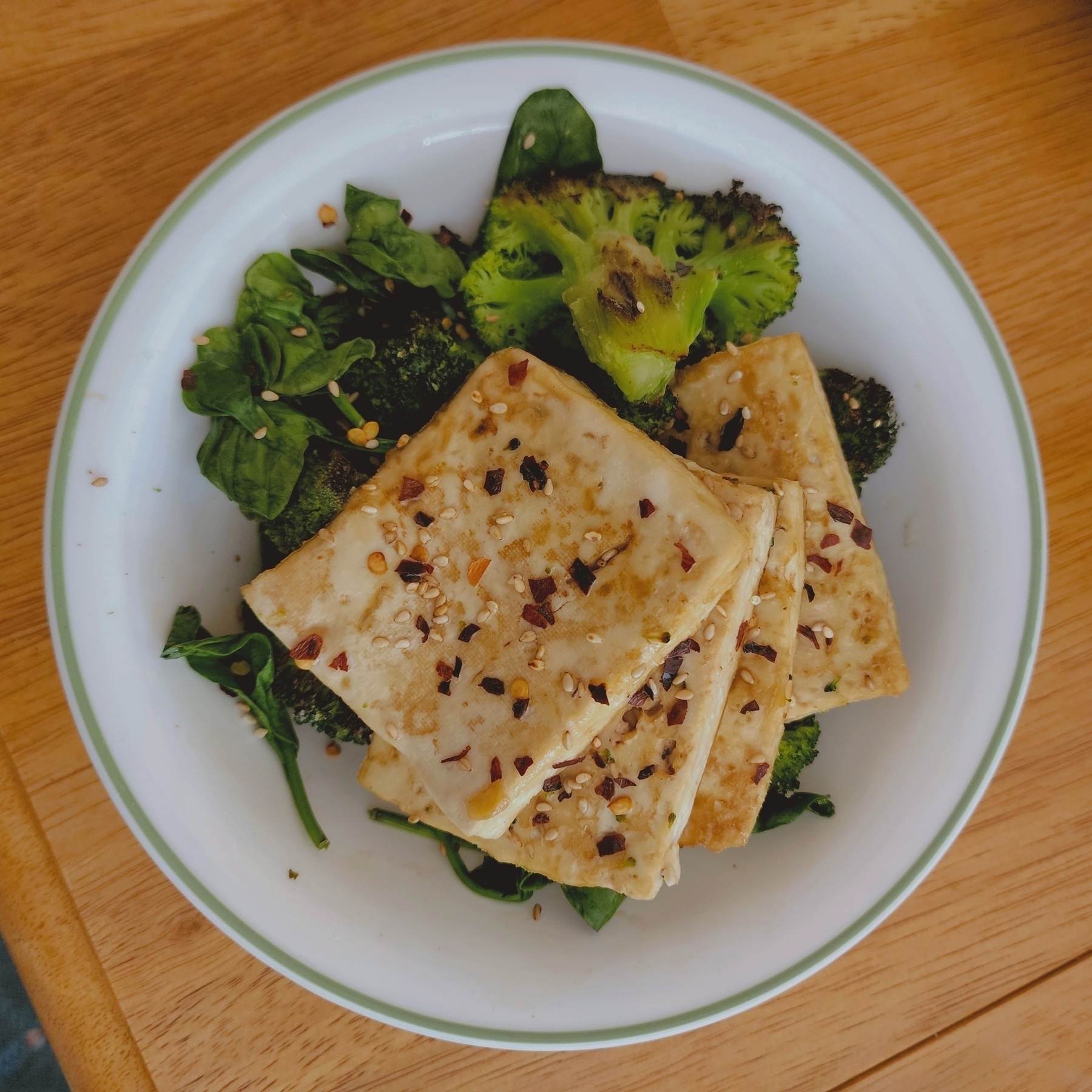 Oven baked tofu, roasted broccoli, slightly wilted spinach in soy sauce and sesame oil