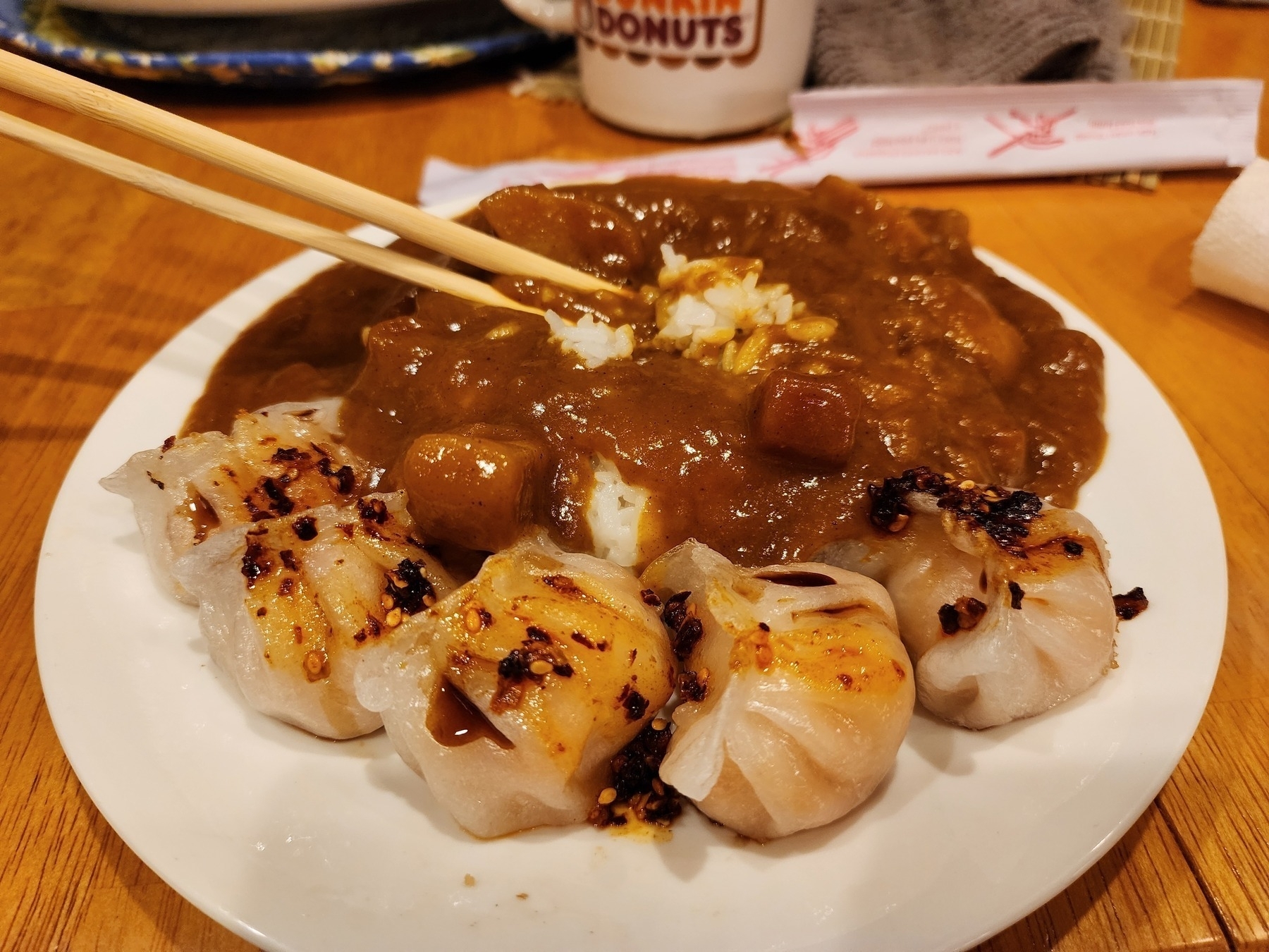 Shrimp har gow with chili oil crunch, soy sauce, curry sauce, white rice