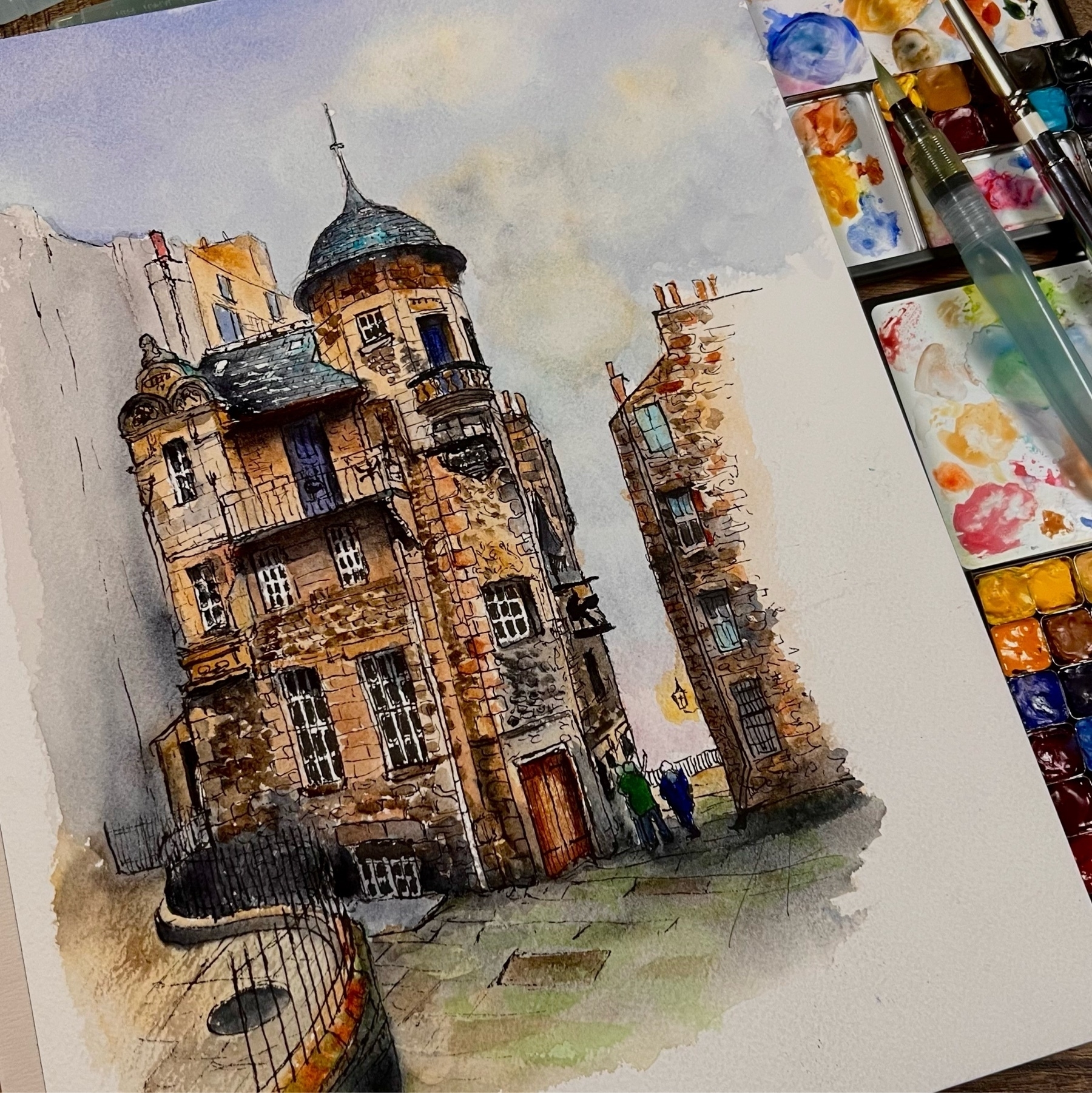 ink drawing then watercolor of the wiritng museum in Edinburgh Scotland. watercolor pans off to the left and a pentel water brush. 