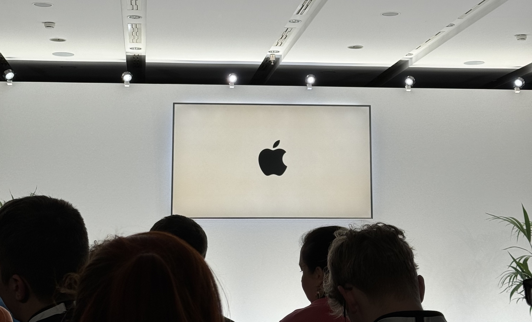 Screen on stage showing the Apple logo.