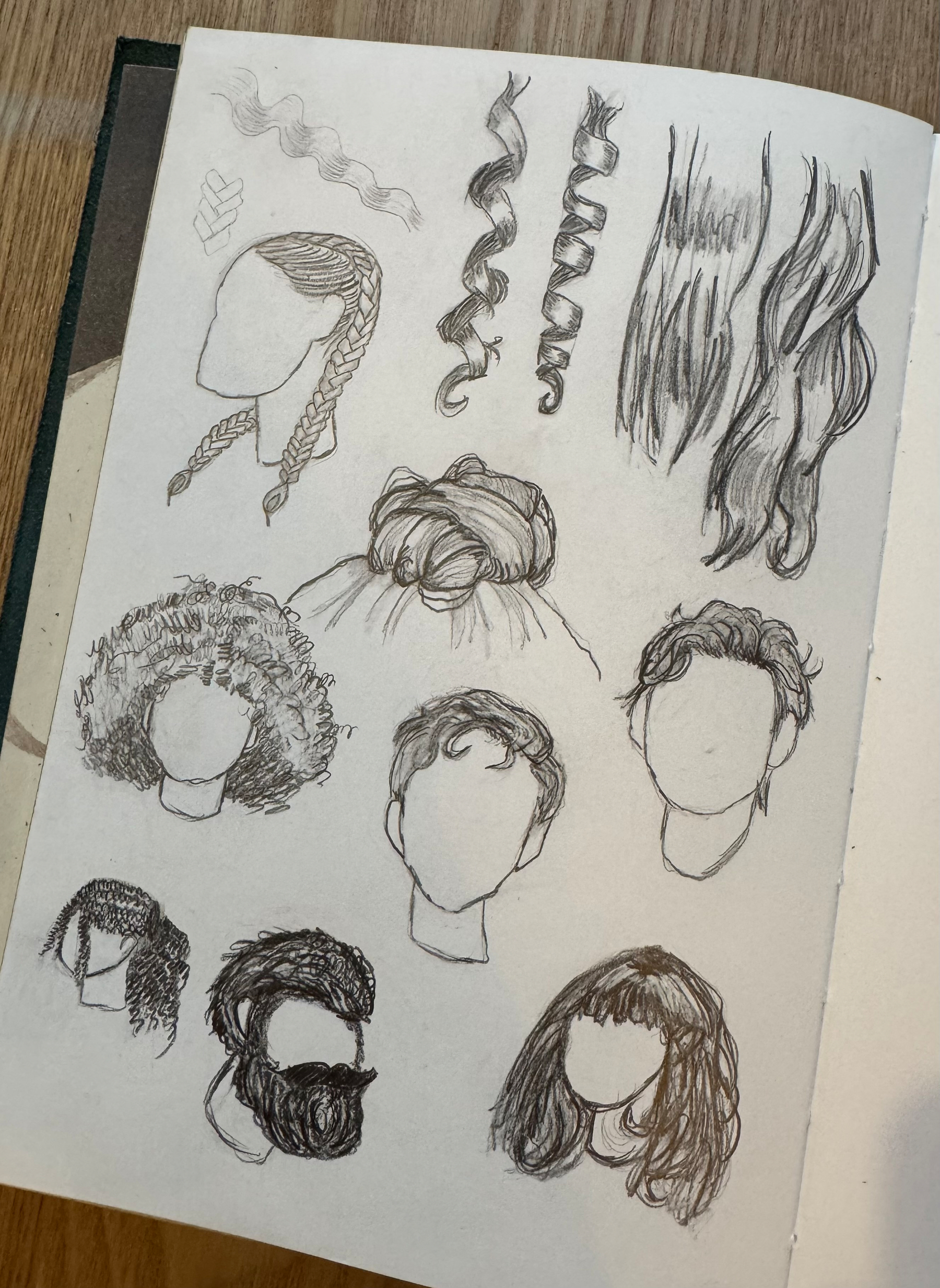 A sketchbook page features various hairstyles, including braids, curls, an updo, and different hair textures on faceless heads.