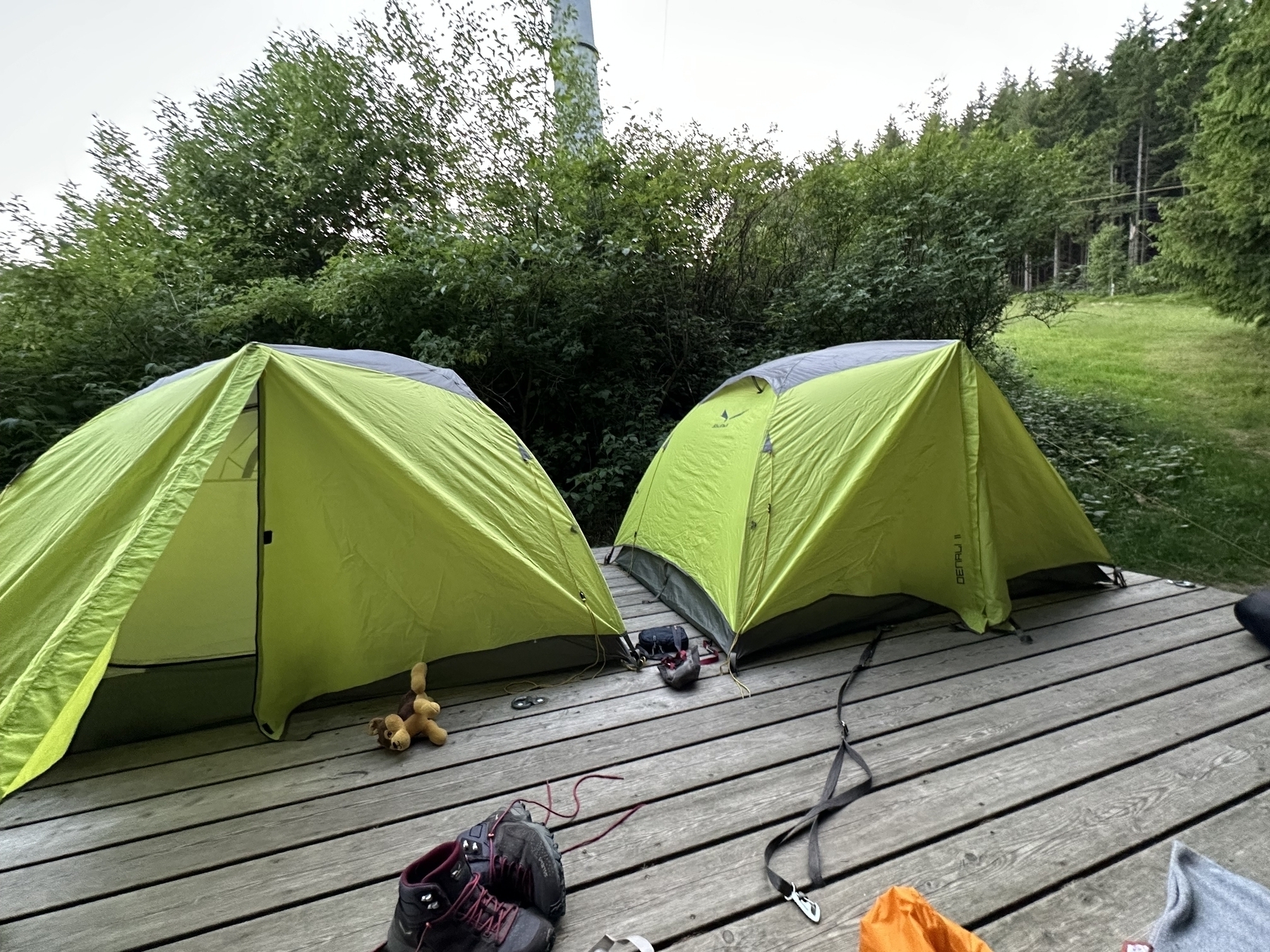 Two small tents on a platform for hikers