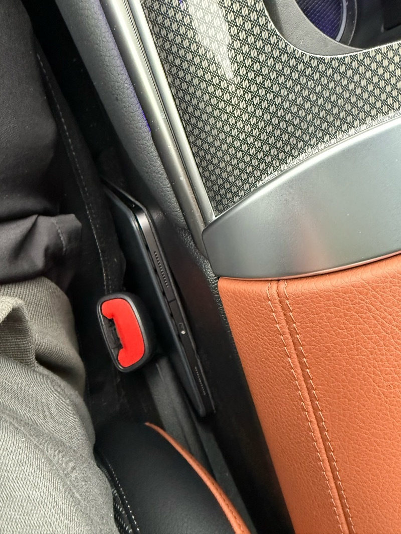 Photo of my iPad in between the driver’s seat and the center console 