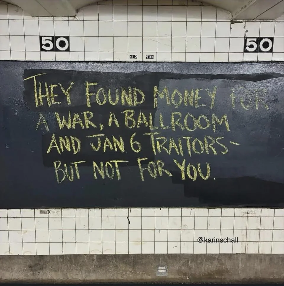 Subway sign stating “THEY FOUND MONEY FOR A WAR, A BALLROOM AND JAN 6 TRAITORS-BUT NOT FOR YOU.”