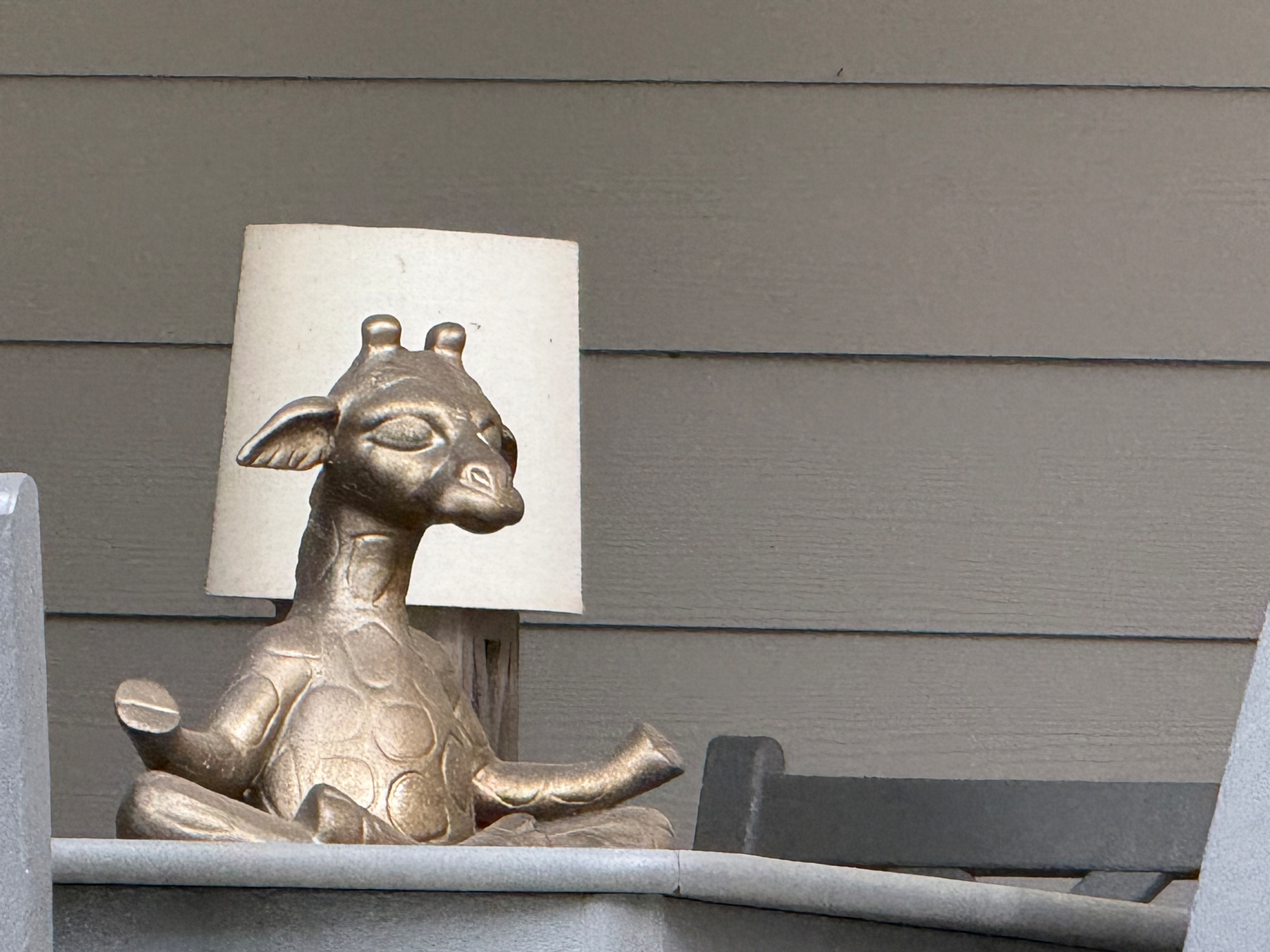 Statue of a giraffe in meditation mode
