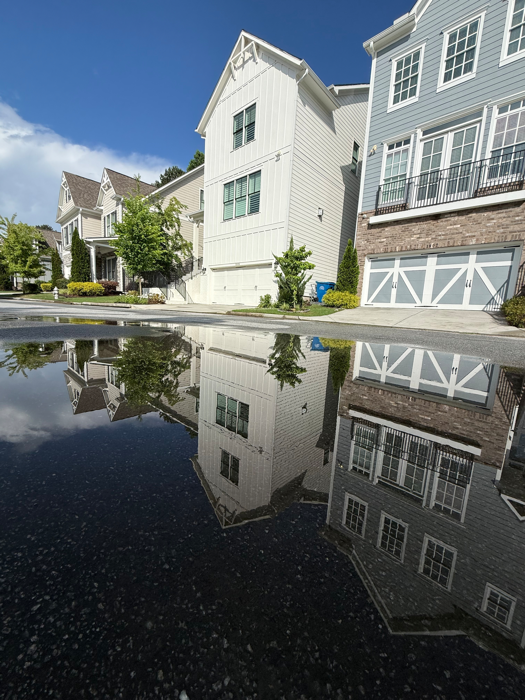Photo of the houses with a reflection from the standing water