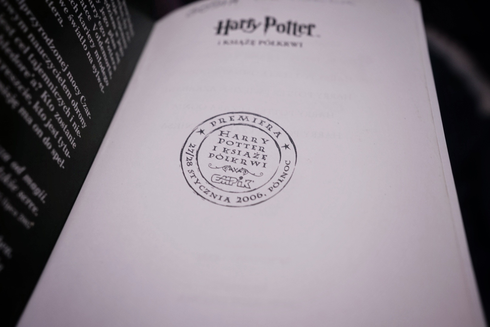 first page in the book Harry Potter and the Half-Blood Prince with a stamp from the Polish premiere of the book in Poland, 2006