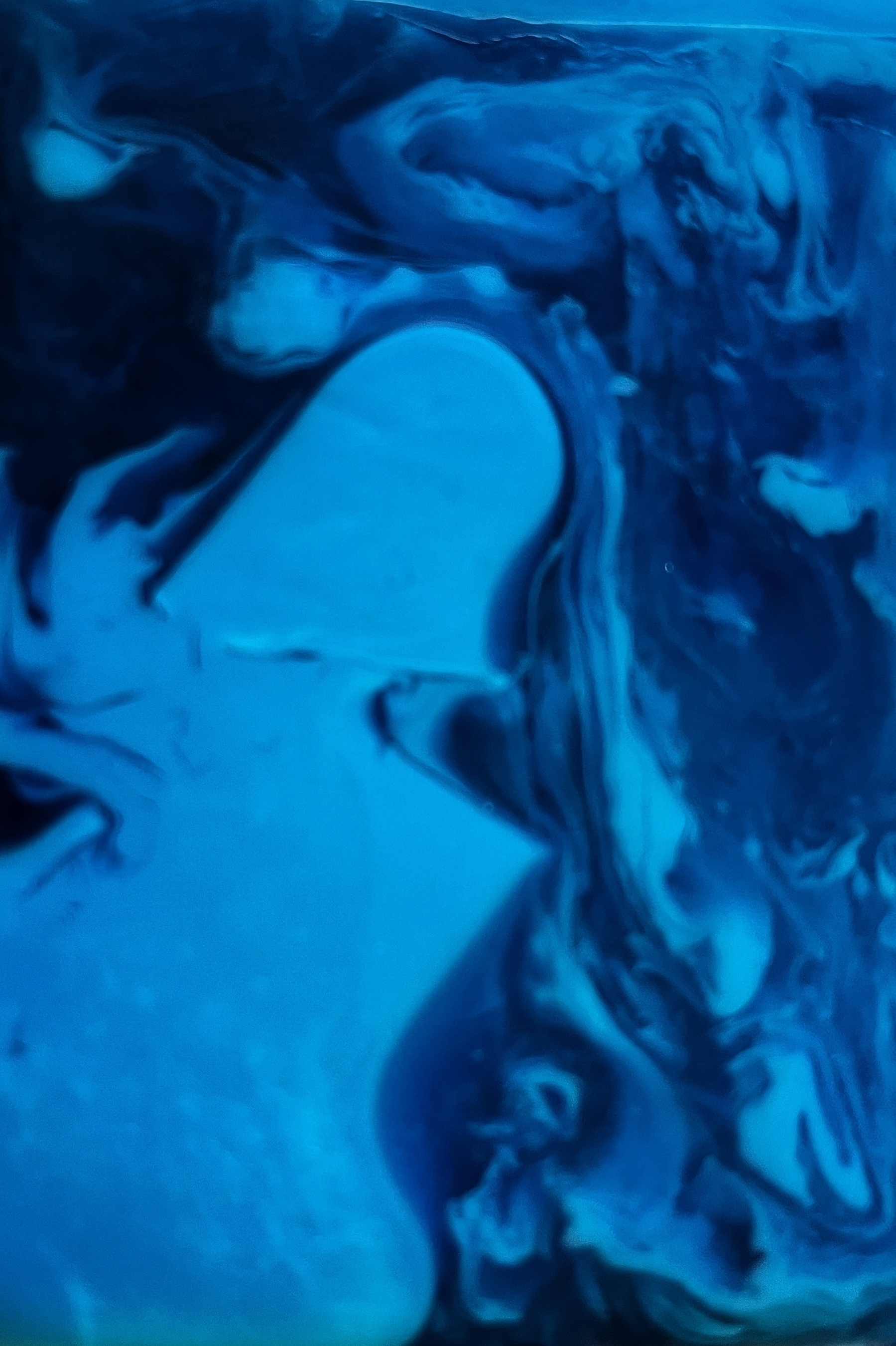 Blue curved and cloudy pattern. Its a zoomed in picture of… a soap