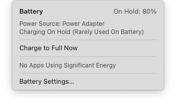 a macOS window showing that the battery charge is “on hold” and the battery is holding an 80% charge. Below, a couple of more options to choose from, including battery settings.
