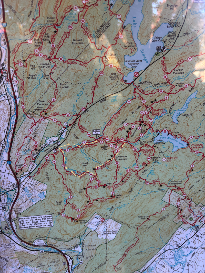 A detailed topographic map shows hiking trails, campgrounds, and natural features