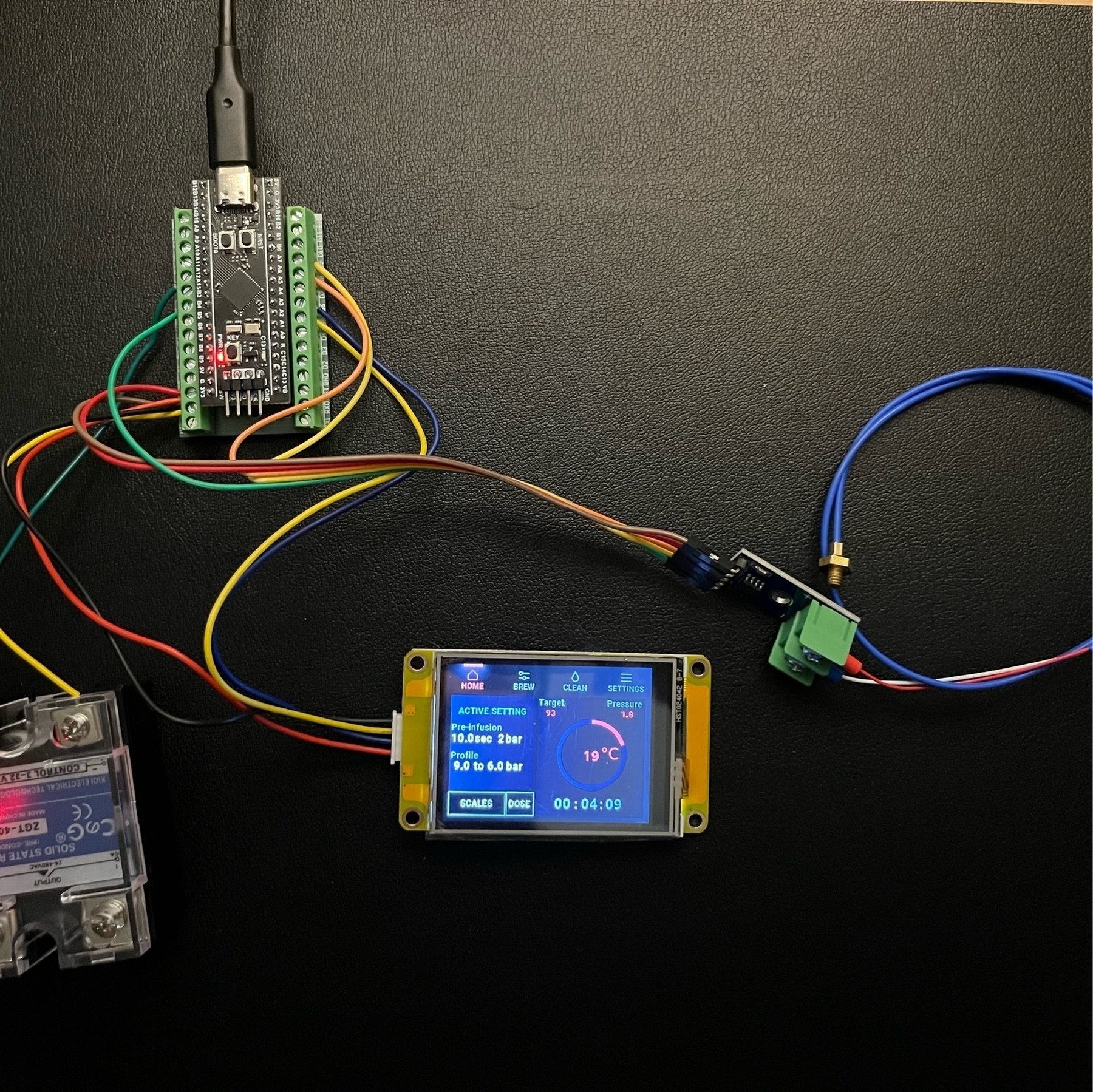 Photo of a microcontroller wired up to a relay, thermocouple, and touchscreen.