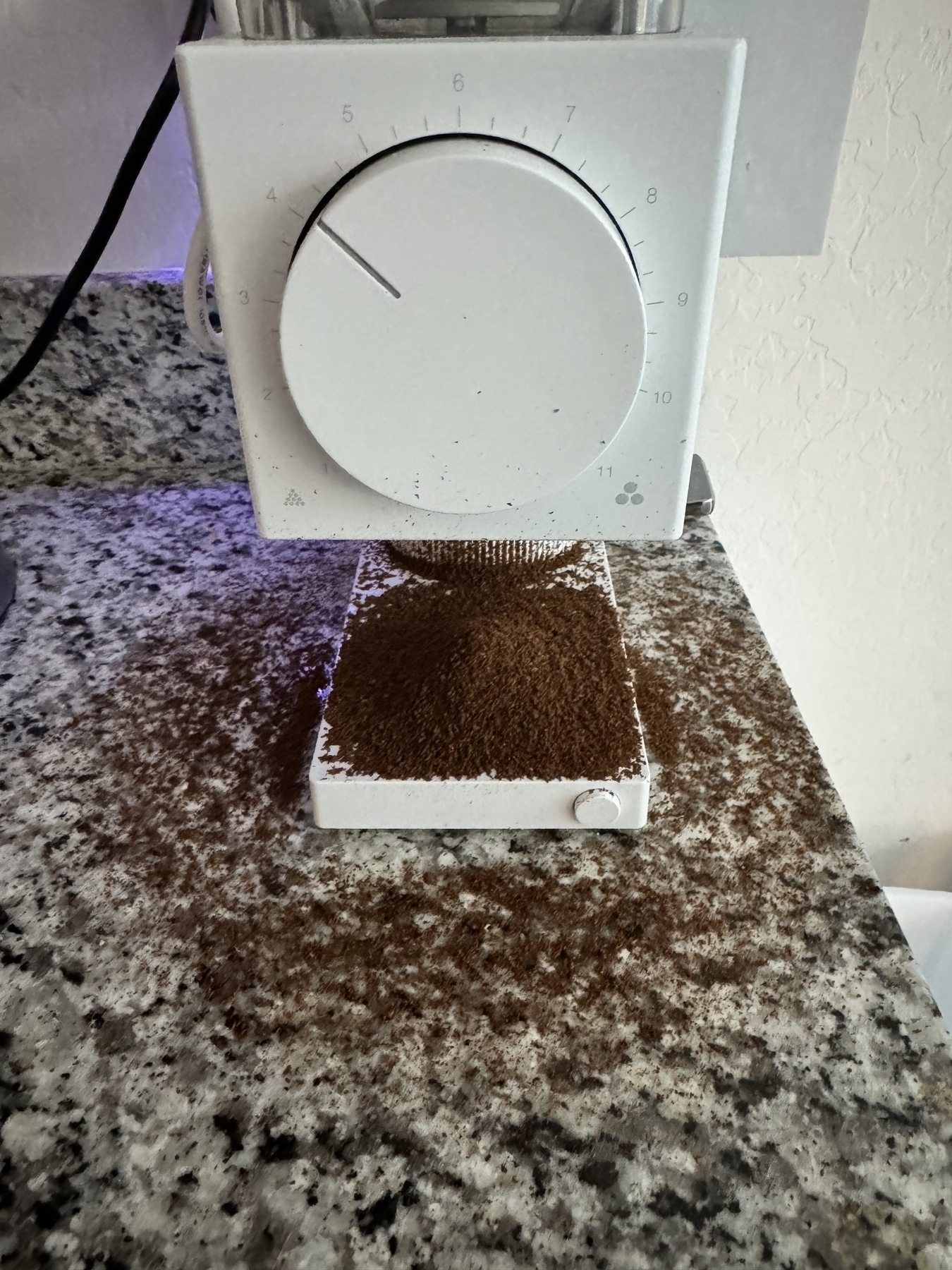 Coffee grounds all over grinder