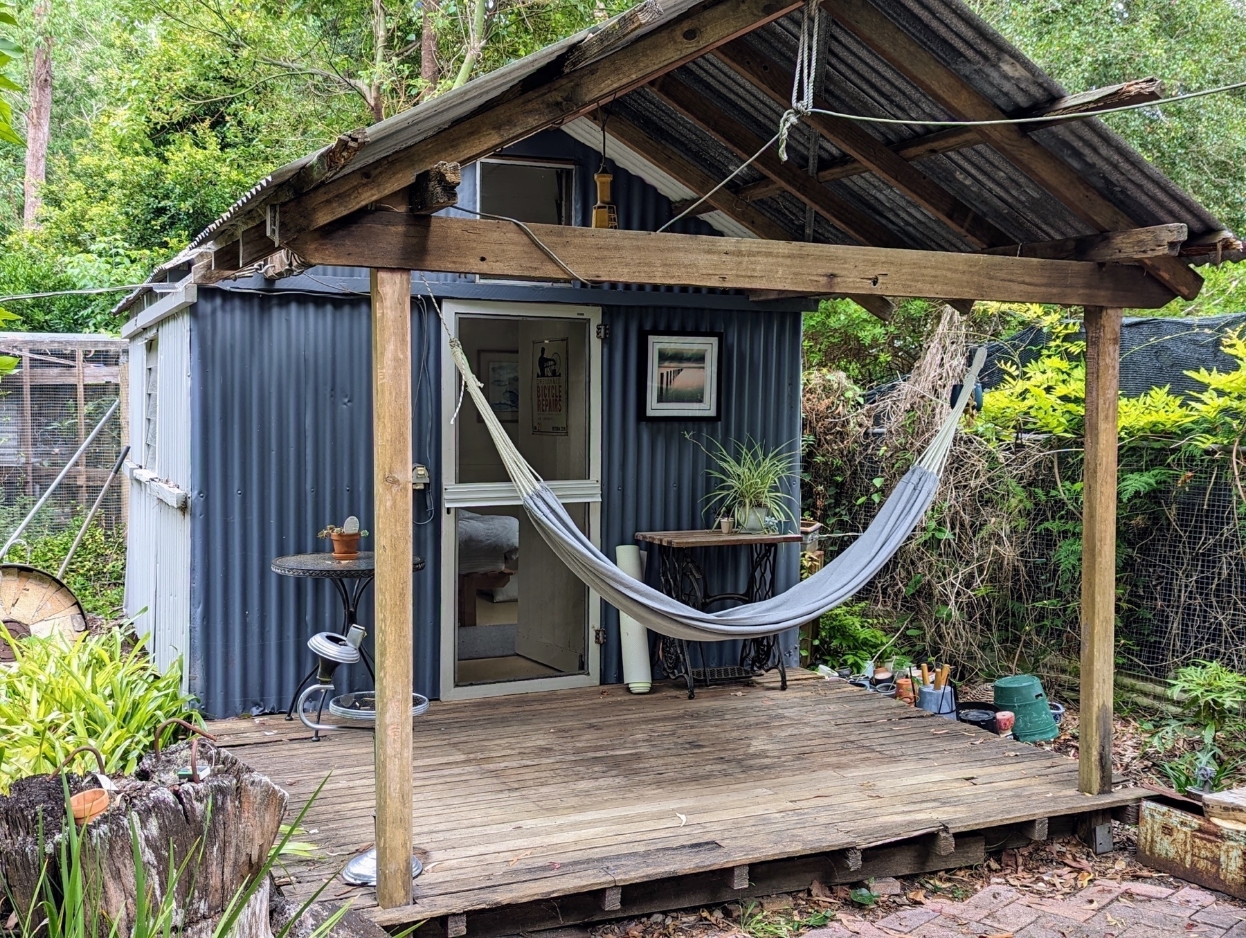 An Australian tin shed with a portico, complete with hammock.