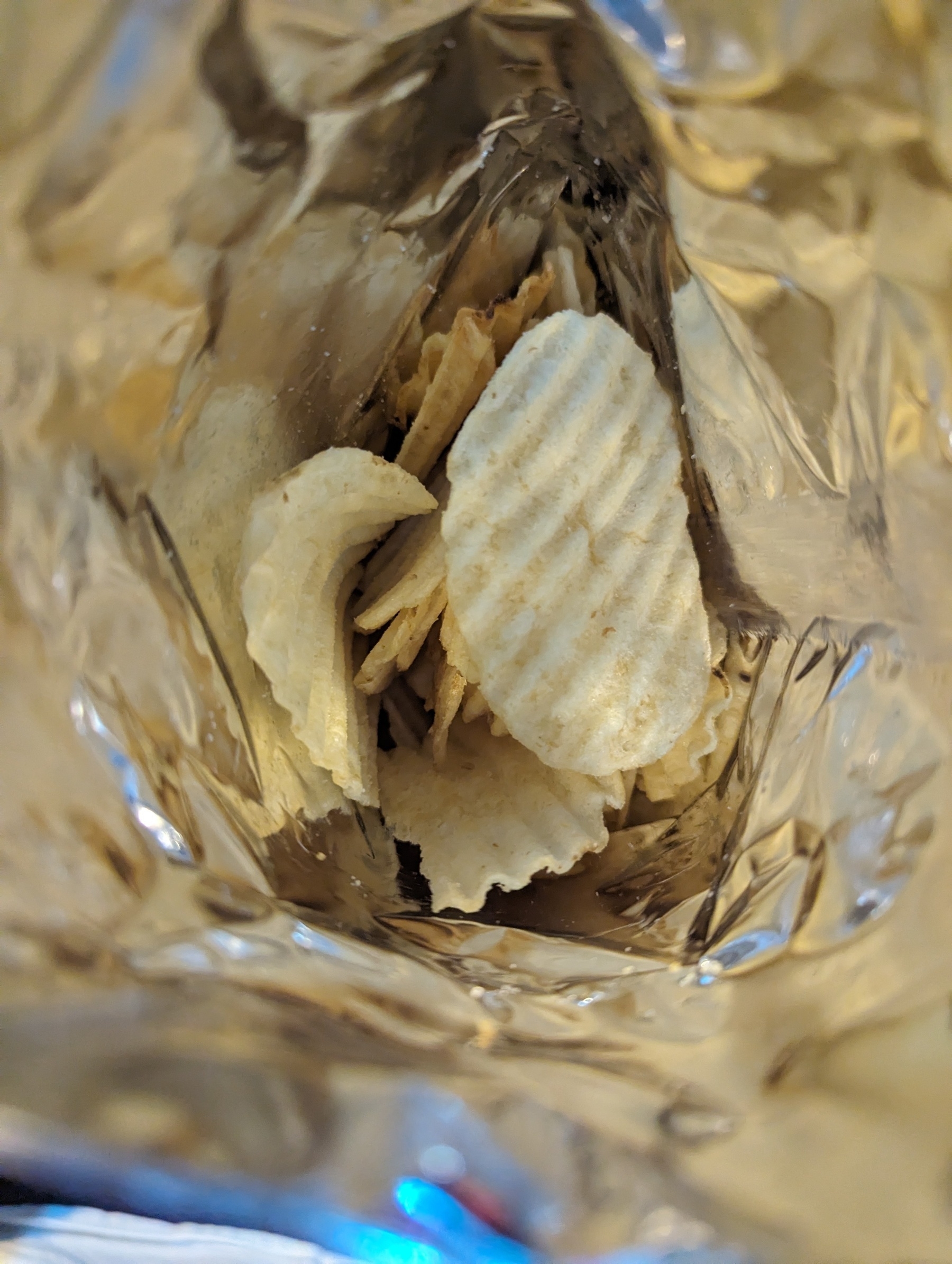 The reflective silver inside of a packet of crisps 