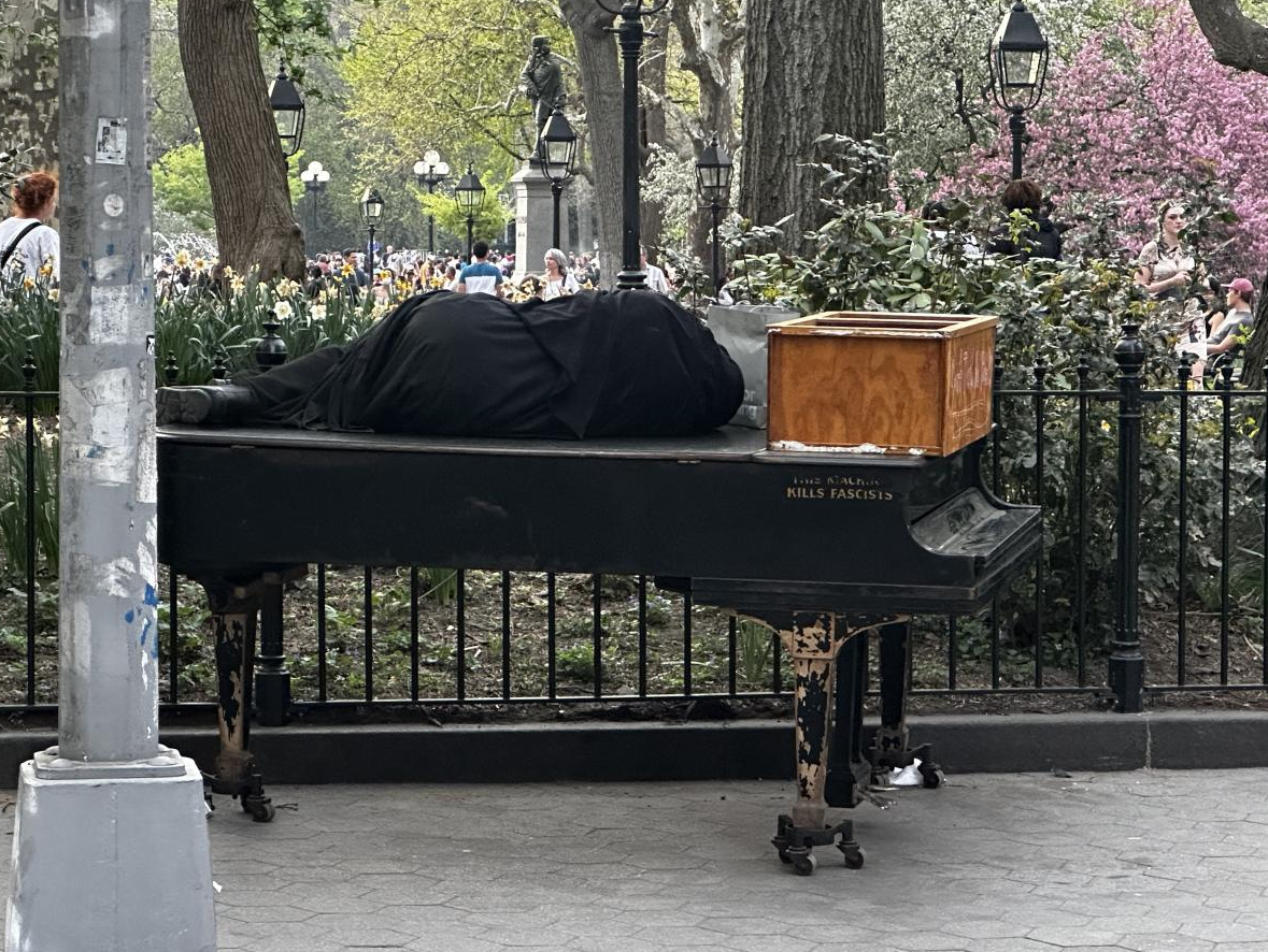 Piano Man sleeping on his instrument.