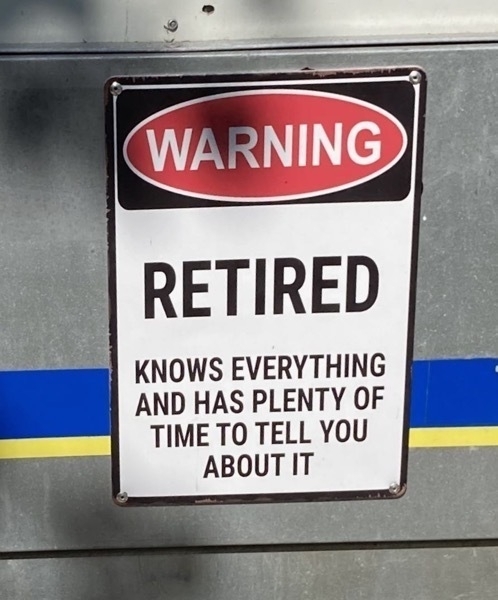 Sign reading "Warning. Retired. Knows everything and has plenty of time to tell you about it."