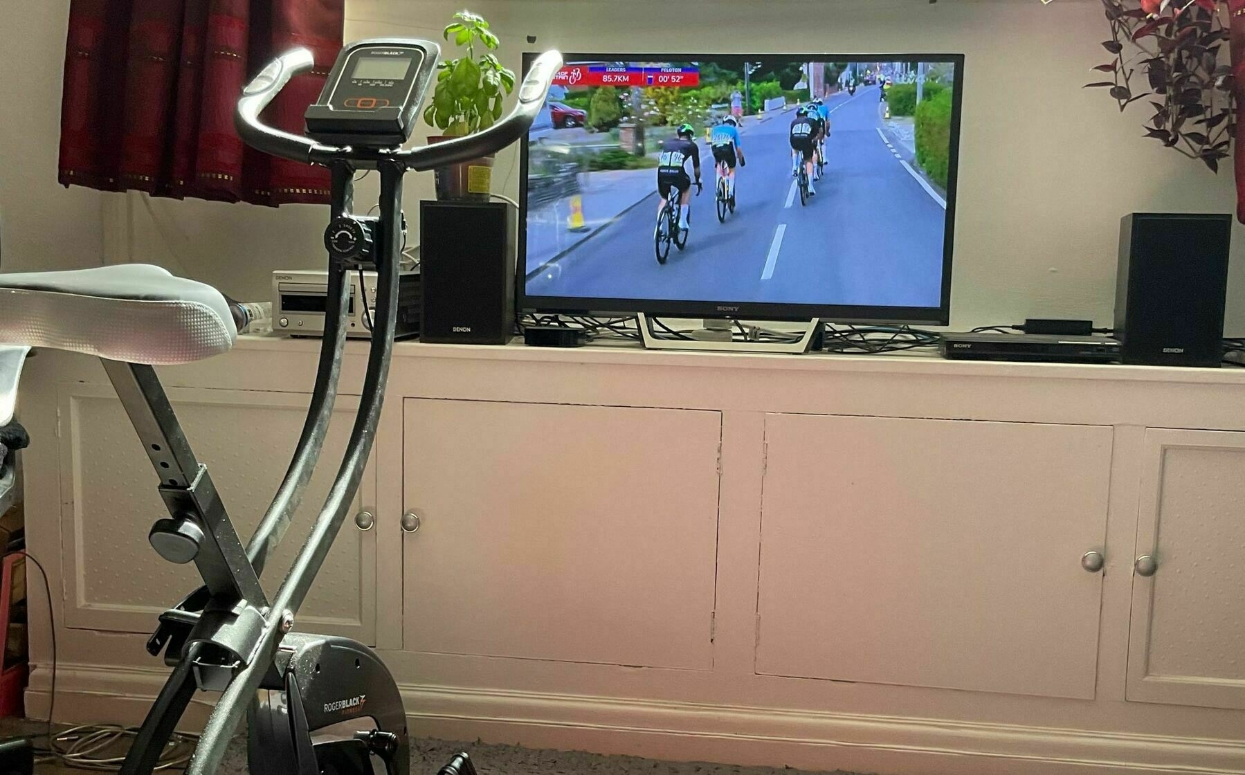 Exercise cycle in front of a TV showing the Tour of Britain cycle race