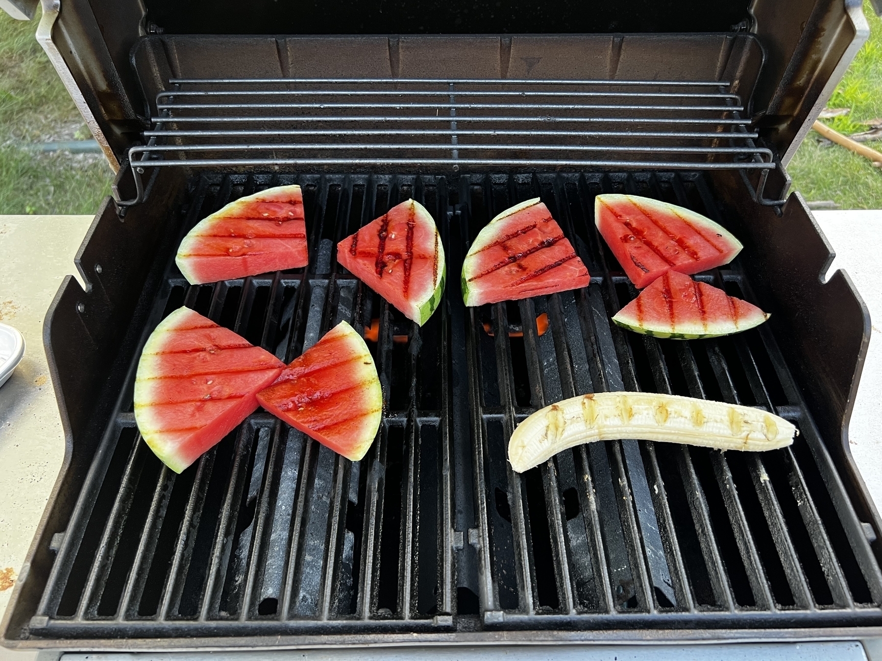 Watermelon slices and banana on a grill 