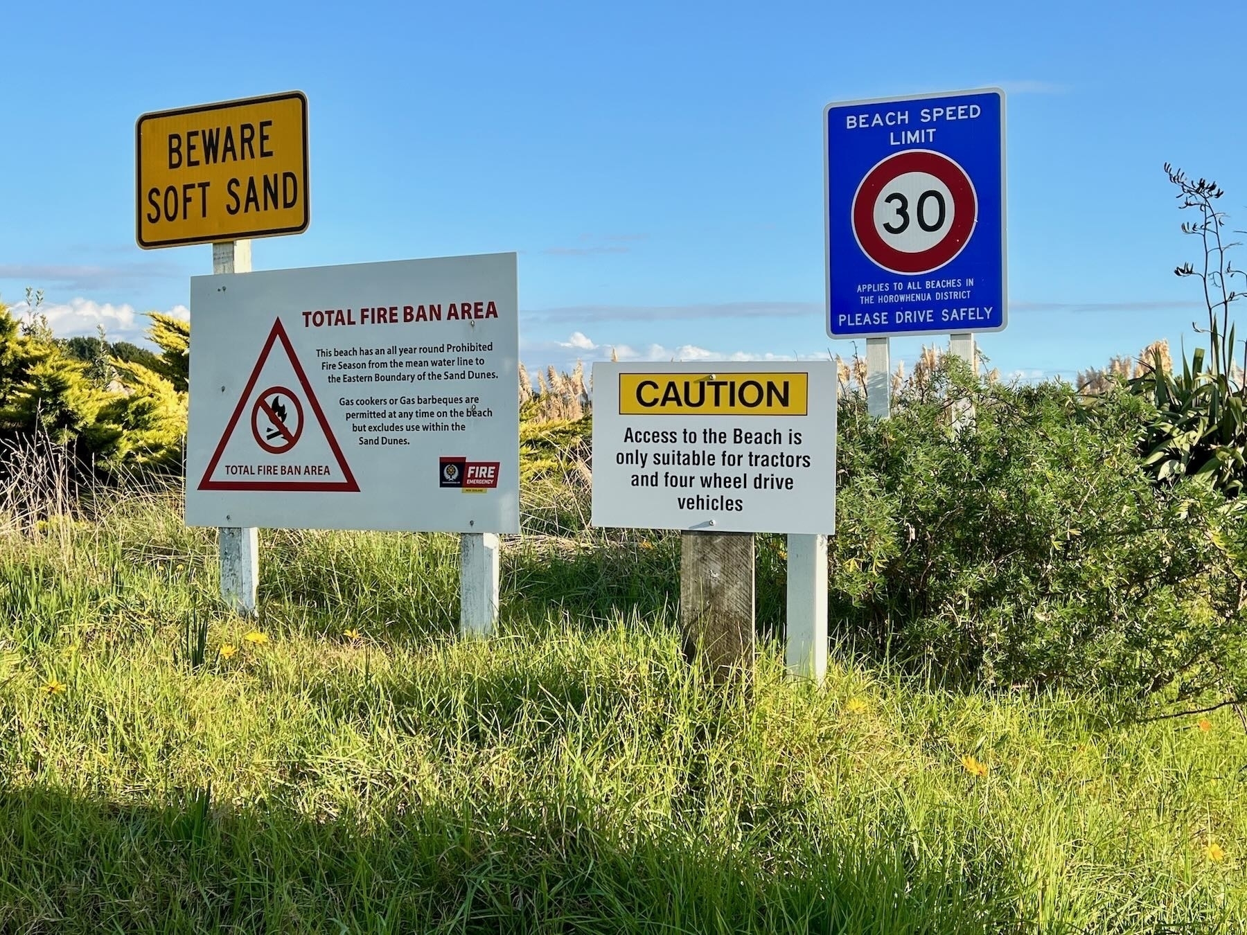 Warning signs at beach entrance. 
