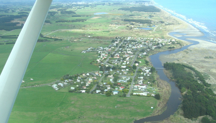 Waikawa River and village from a plane, looking south.