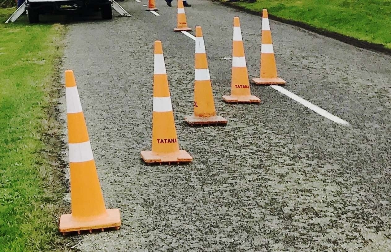 Orange cones across the road. 