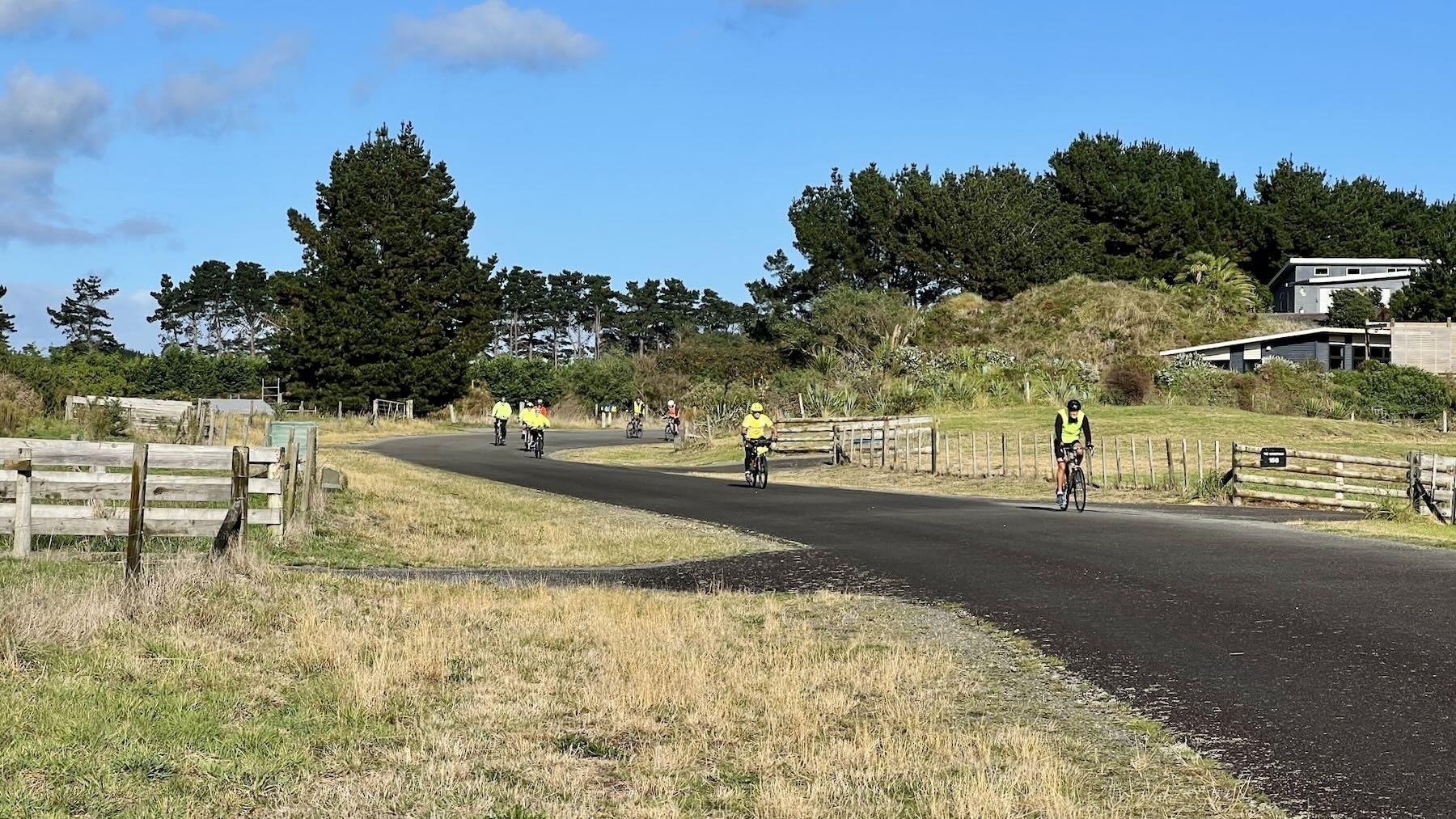 A flock of cyclists on Strathnaver Drive. 