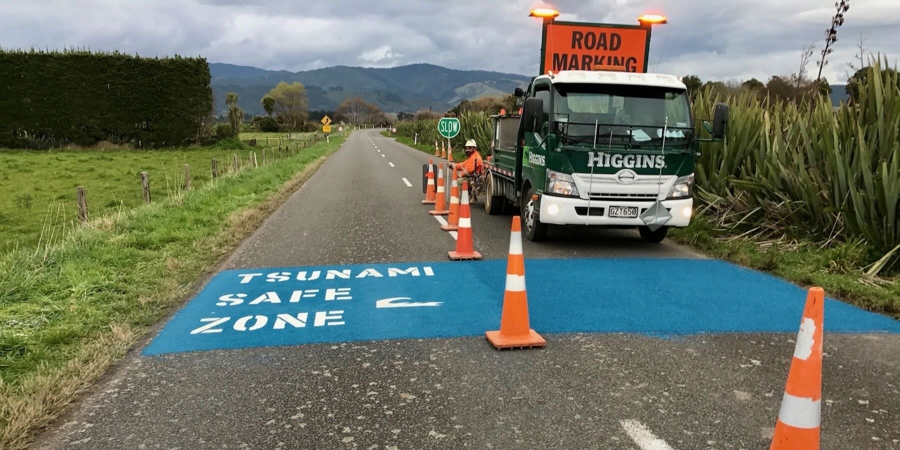 Fresh blue road markings show the tsunami safe zone. 