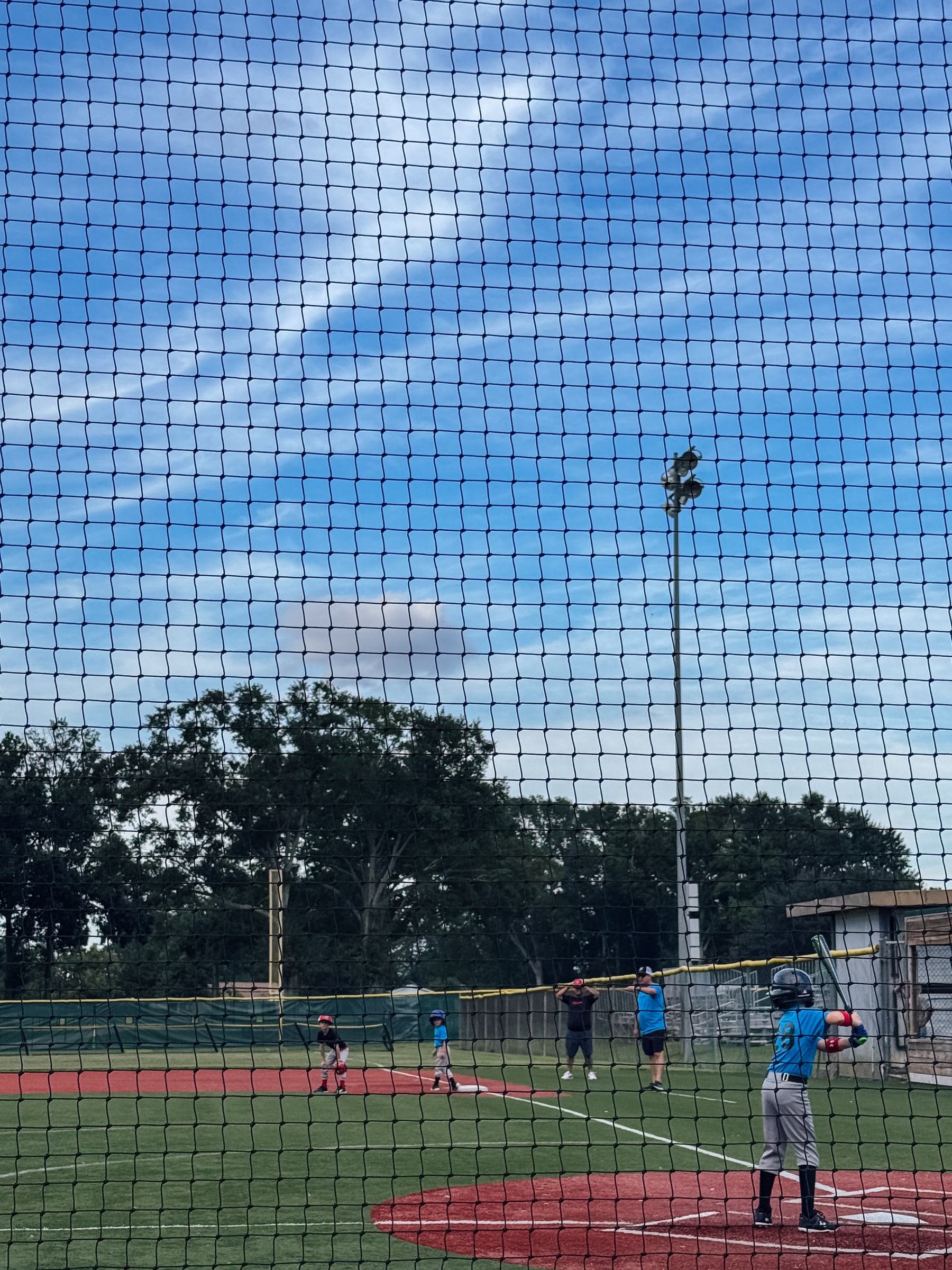 Photo of a boy batting