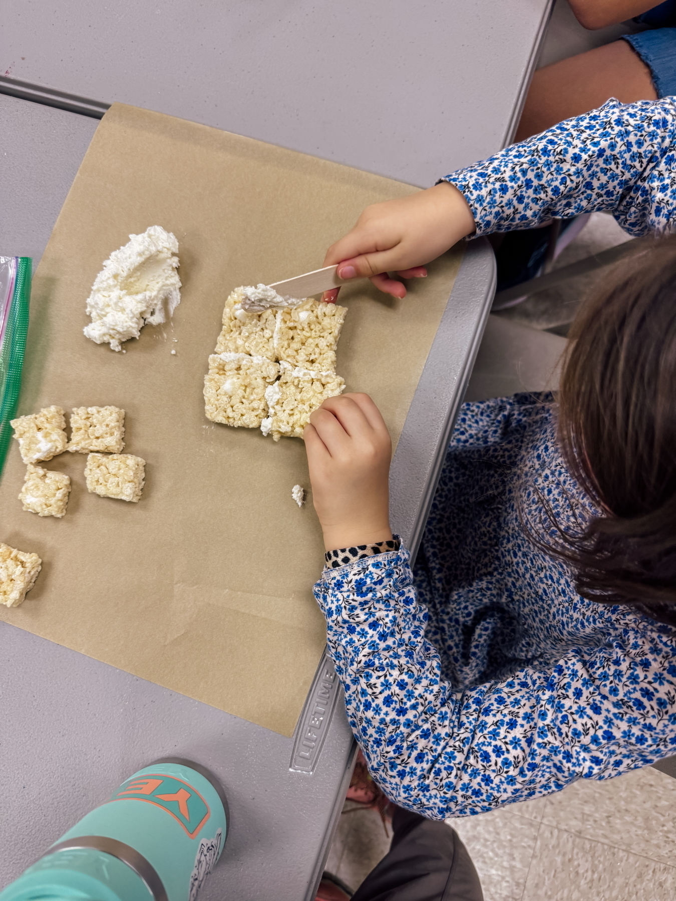 A child making a Rice Krispie Pyramid