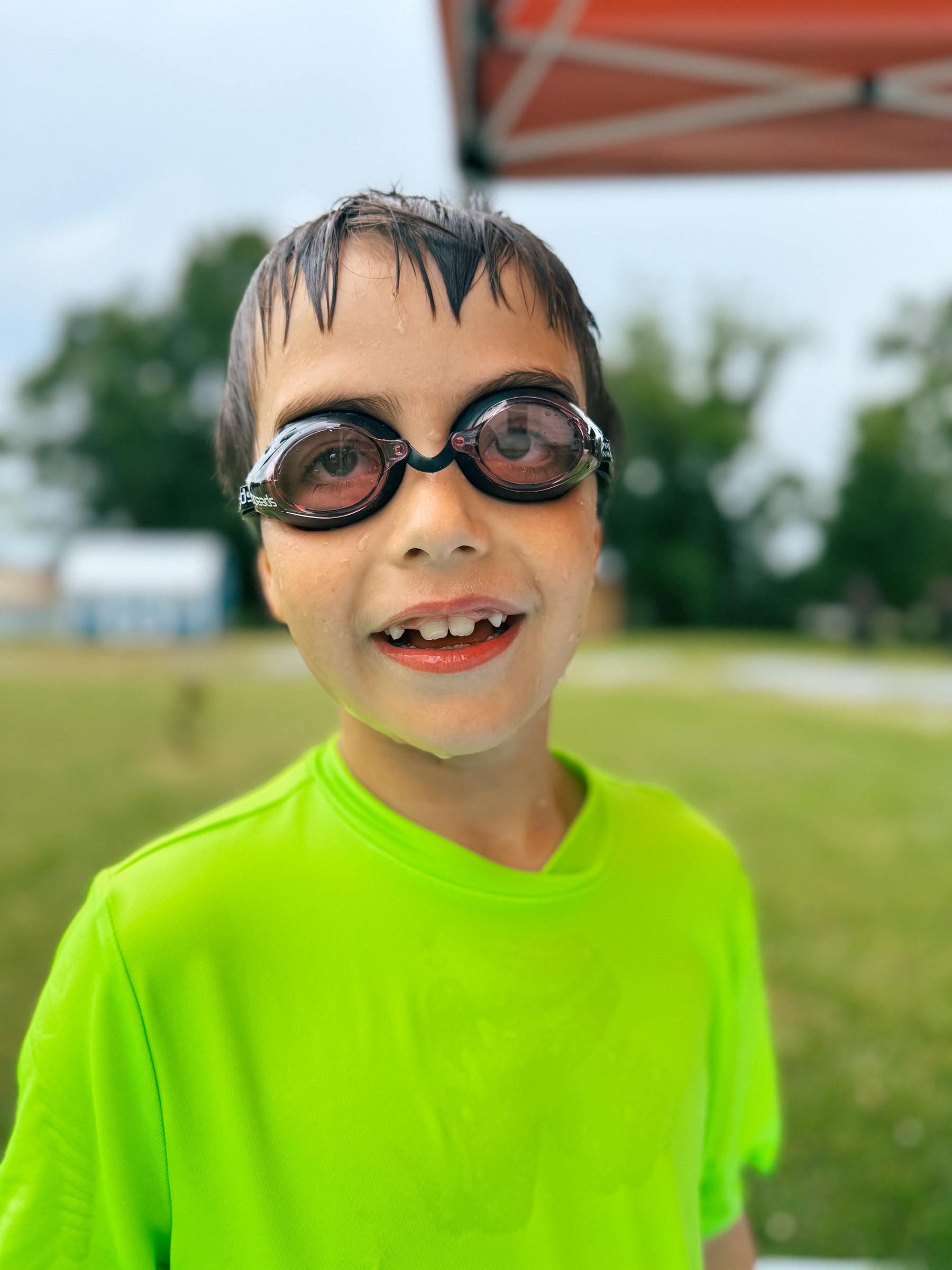 A boy in swimming goggles