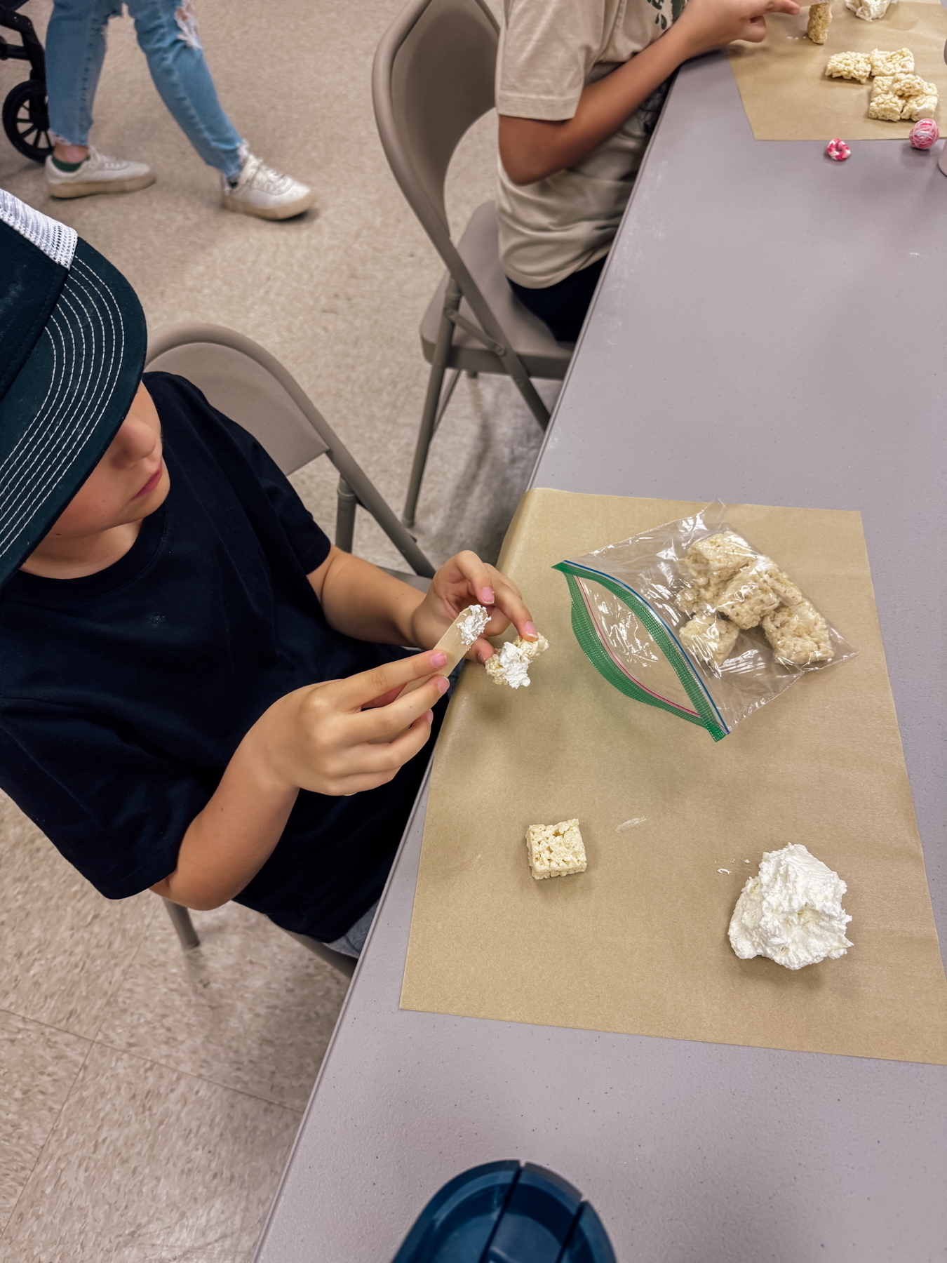 A child making a Rice Krispie pyramid