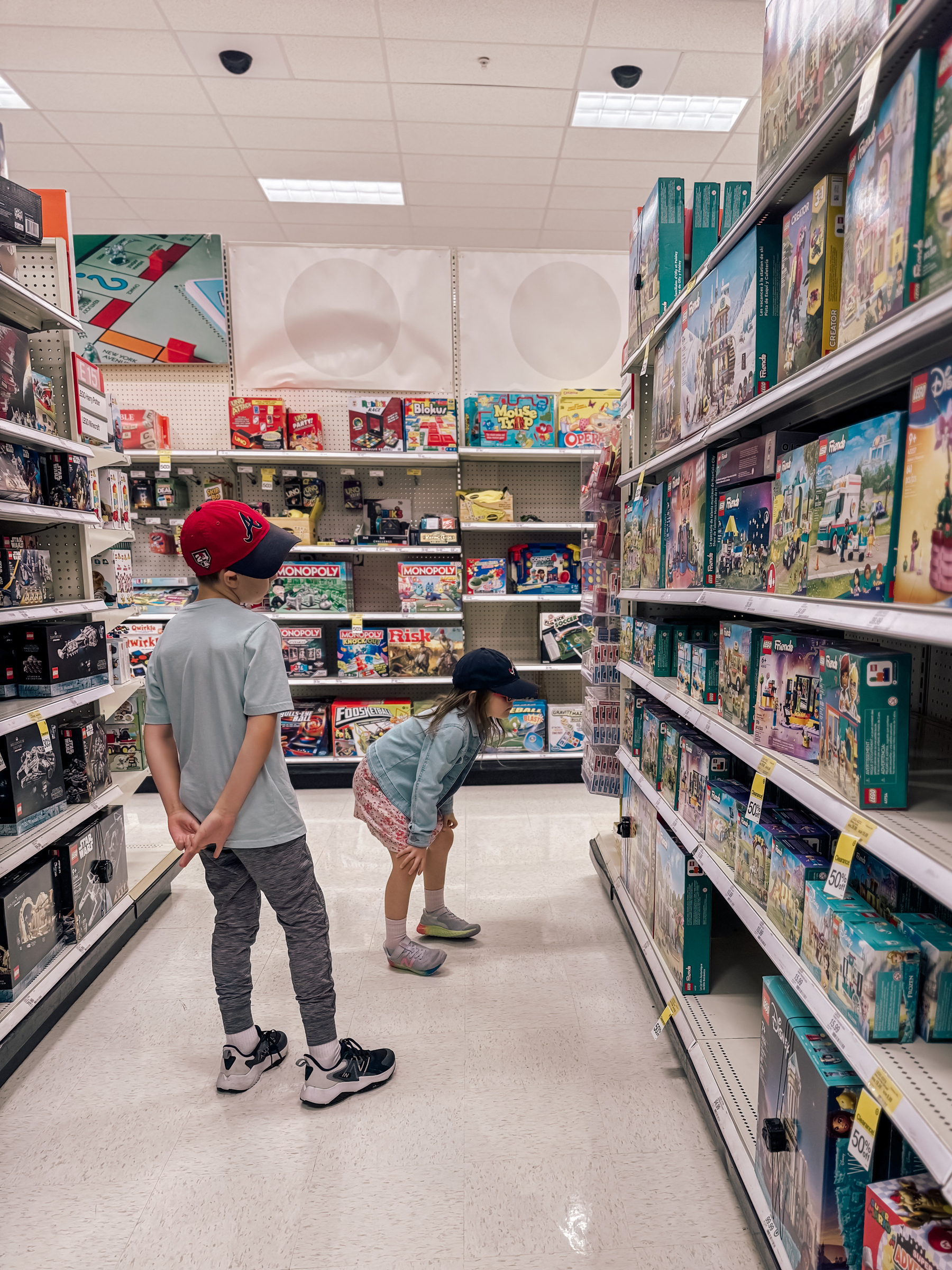 Two kids looking at the Lego aisle in Target