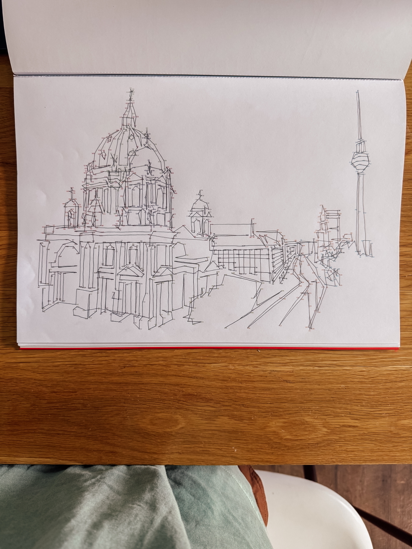 Auto-generated description: A dot-to-dot sketch depicts a cityscape featuring a domed building and a tall observation tower.