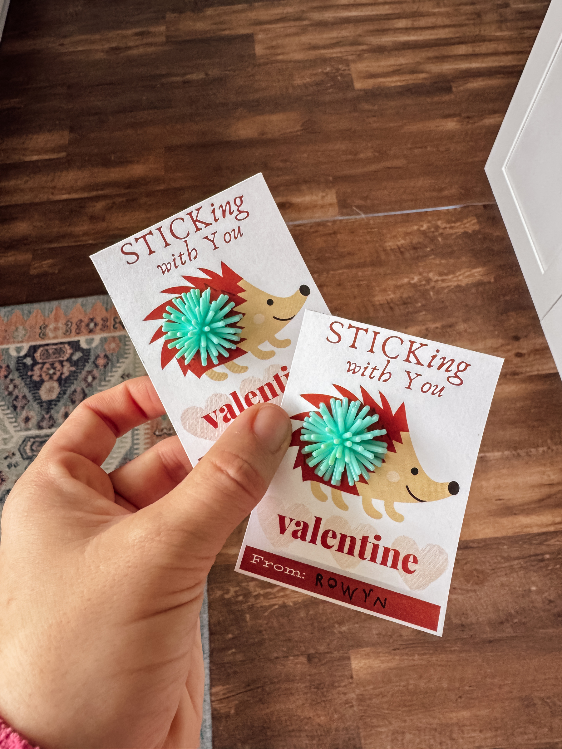 Two Valentine cards featuring a hedgehog design with a small spiky ball gift attached